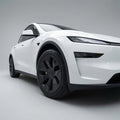 TESEVO Model YL 19 Machina 2.0 stealth blackout wheel covers installed view