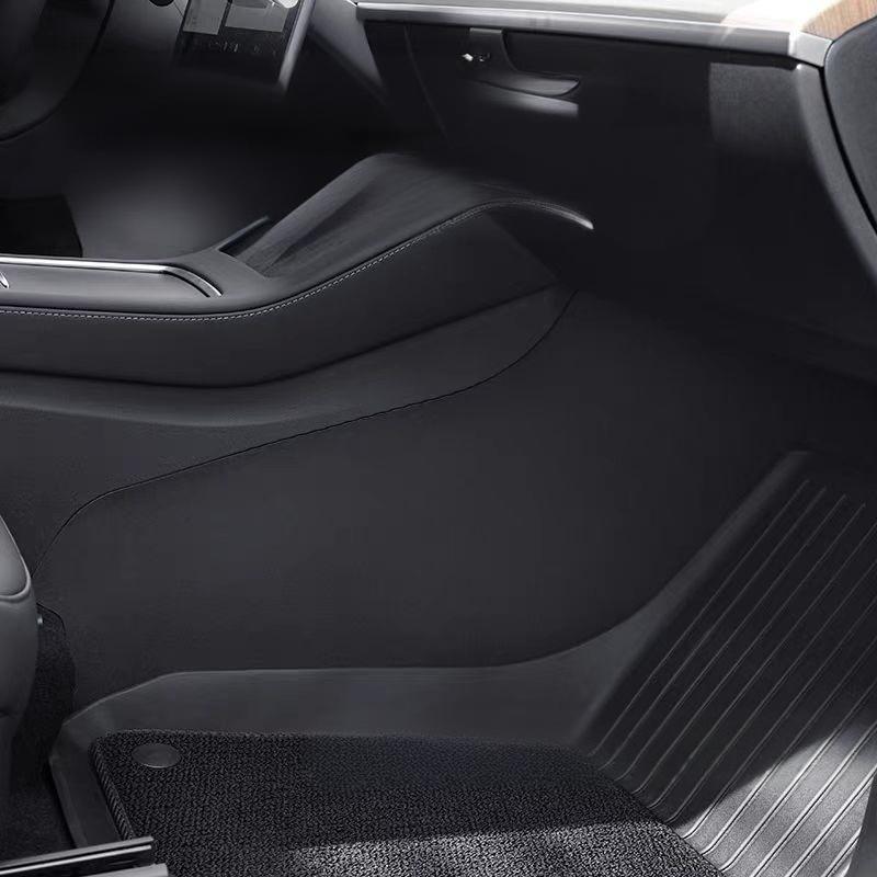 Close-up of Tesevo vegan leather center console side protection mats